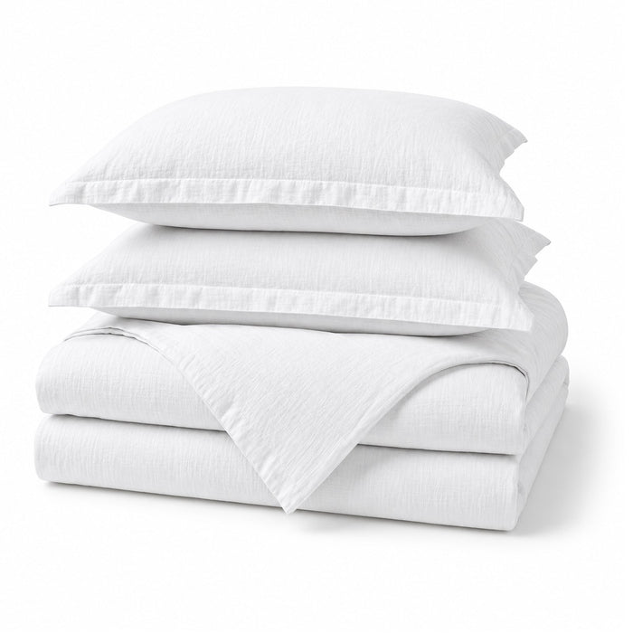 Alaskan King Linen Duvet Cover Set in White, folded, shown on a white background, AI-generated illustration